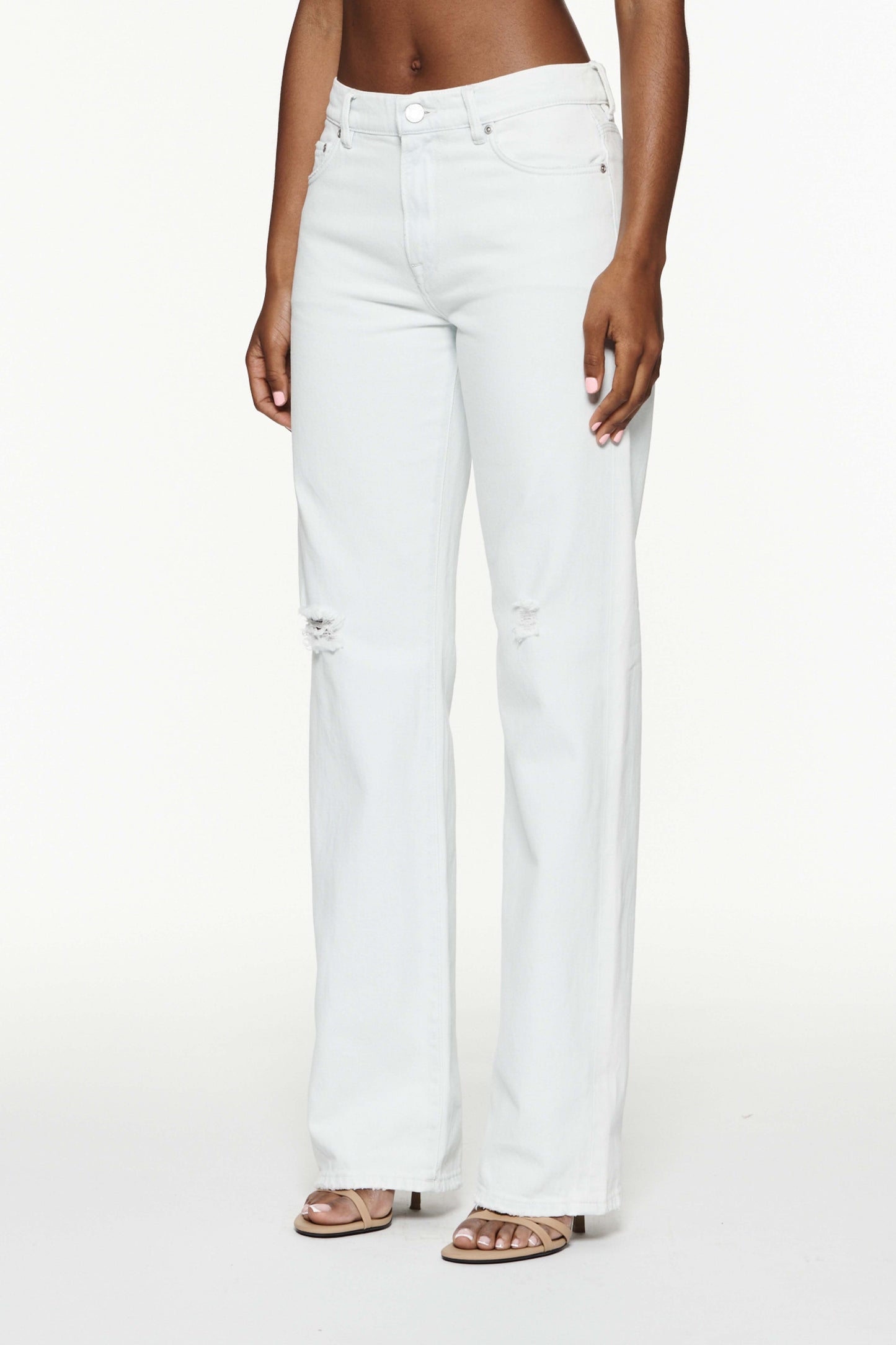Slim Straight denim in total bleach with 5 pocket style and front zipper fly.