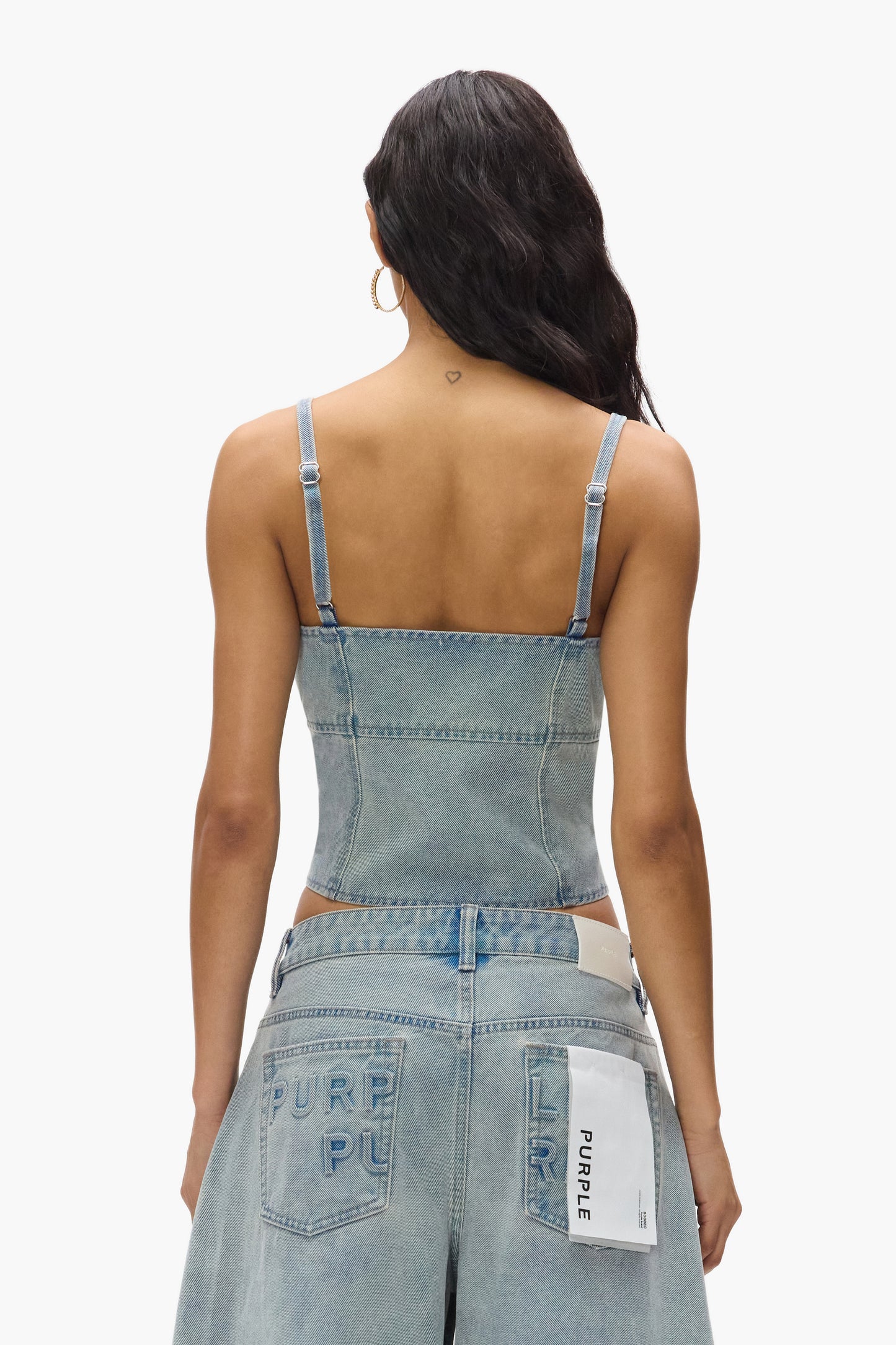 Front Zip Corset in novelty wash denim with adjustable straps and center back zipper.