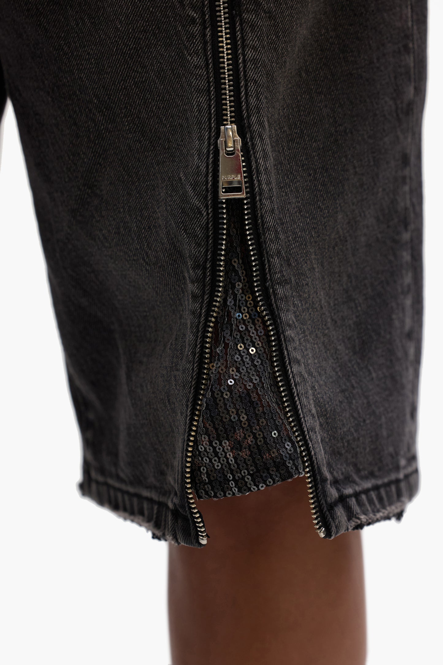 Zip Denim Short with front zipper fly and zipper down both legs, available in various sizes.