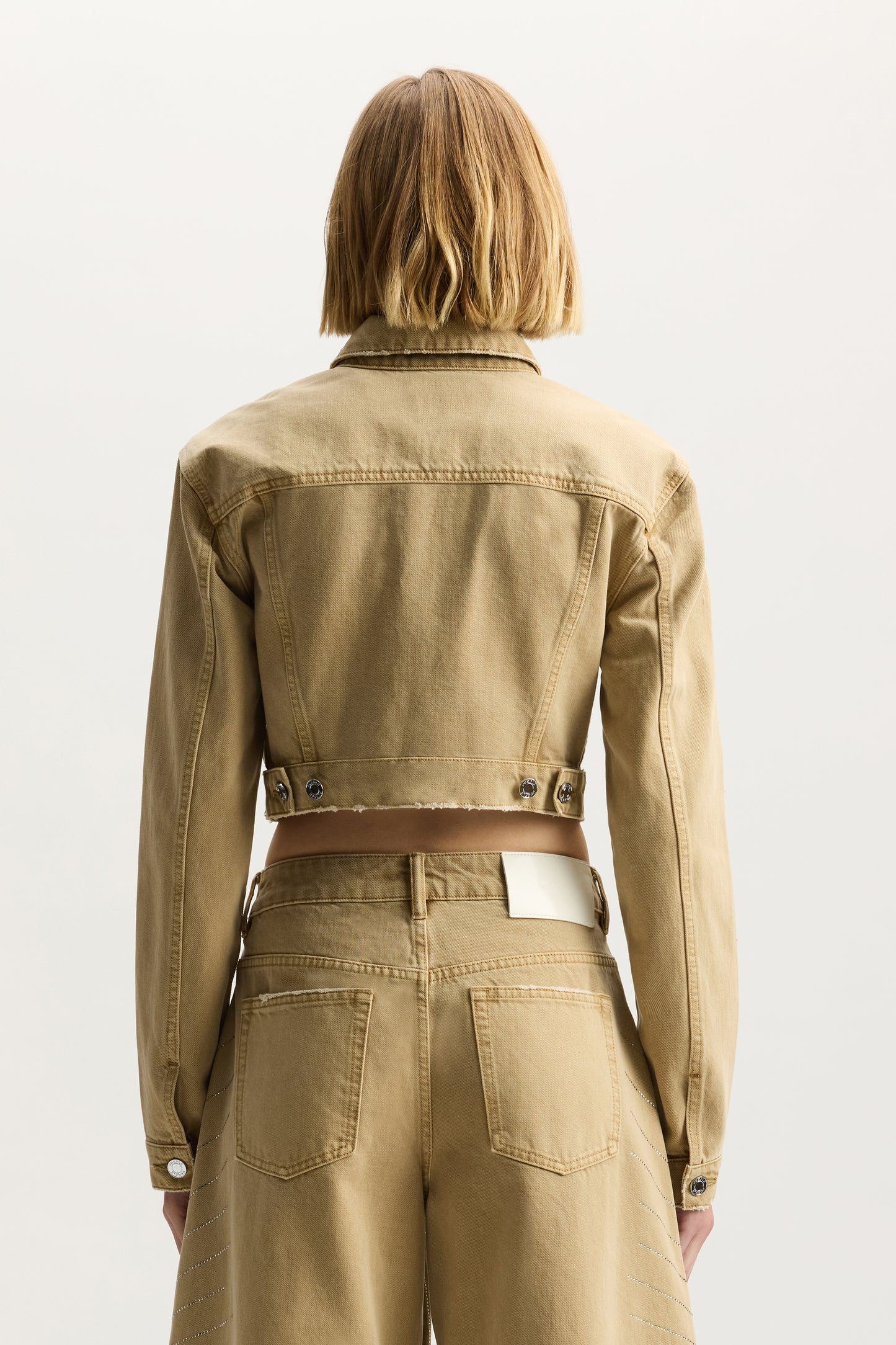 Radial Bling Crop Jacket with front pockets, button closure, and adjustable tabs.