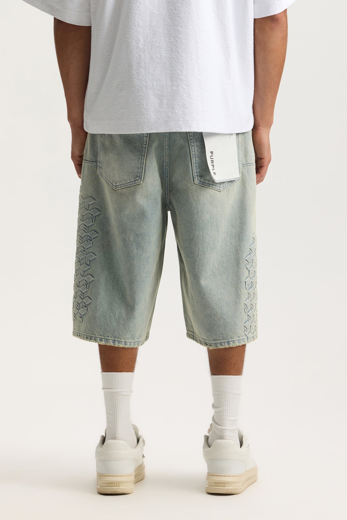 P070 Monogram Embossed Shorts in various sizes with reinforced belt loops and front pockets.