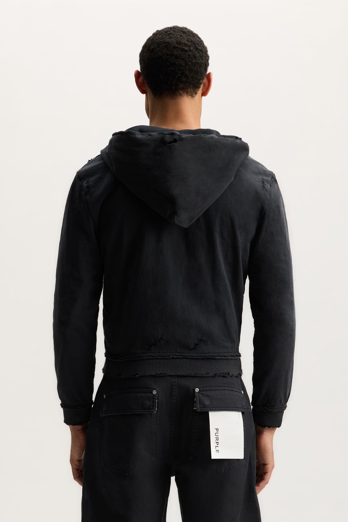 Script Zip Up Hoodie in white, shrunken fit with cropped length and kangaroo pocket.