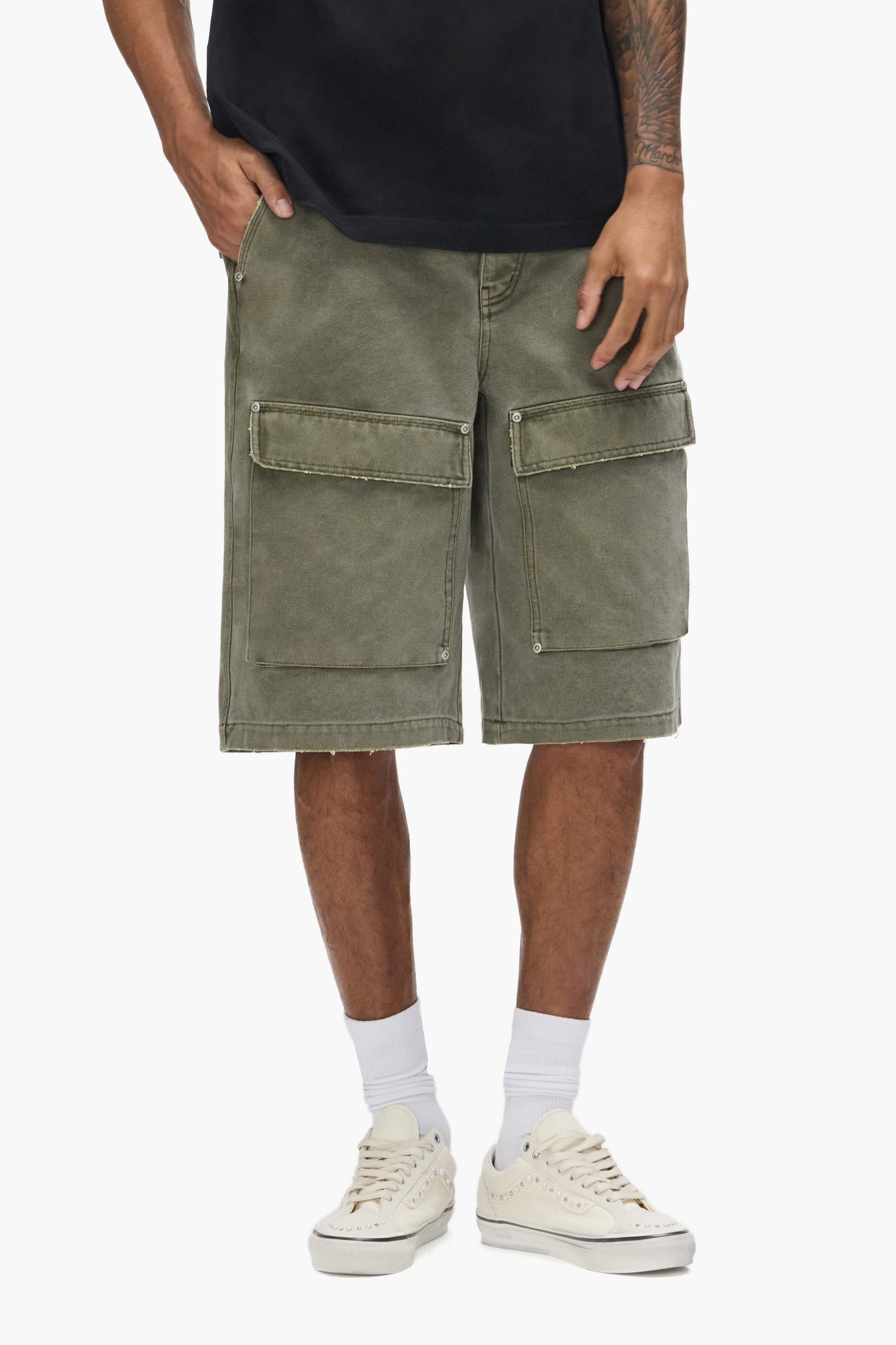 Canvas Cargo Short in relaxed fit with patch on front pocket, available in sizes 28-42.