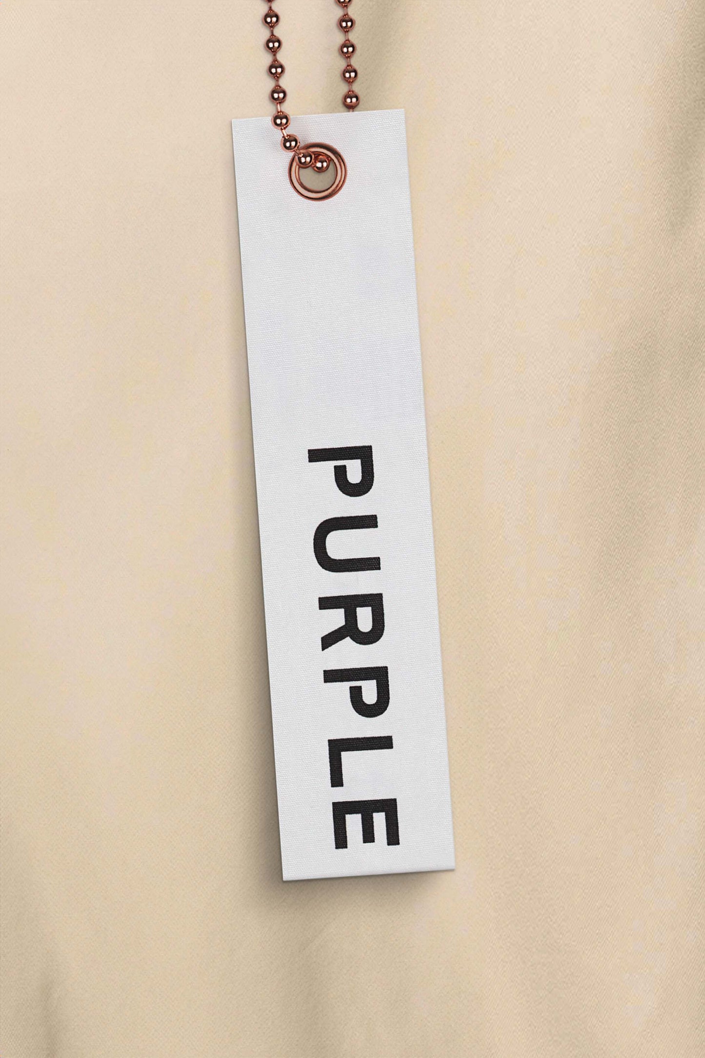 Relaxed tan Wordmark Woven Pants with a loose fit and wide leg, made from 100% cotton.