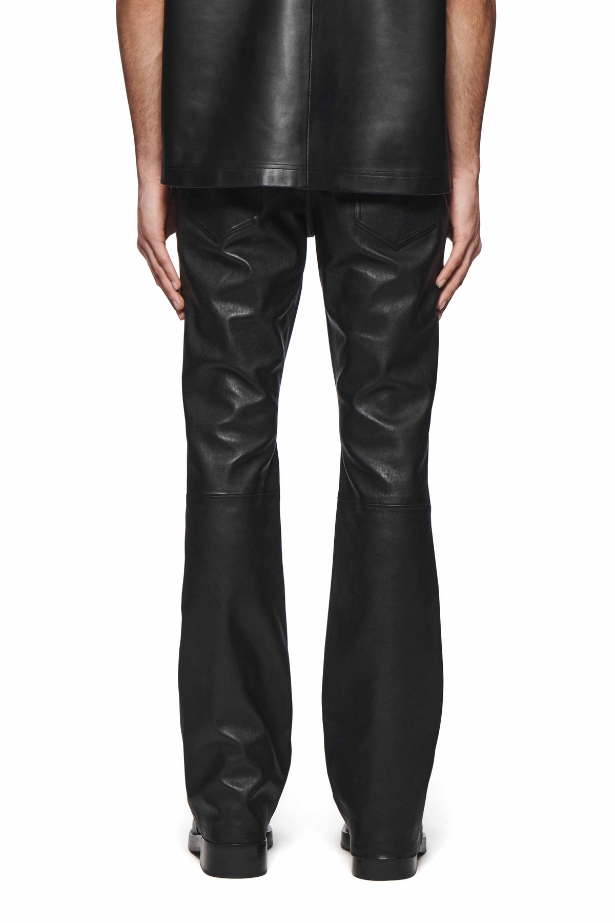 Black Leather Flare Pants tailored with a flared leg, made from 100% lamb leather.