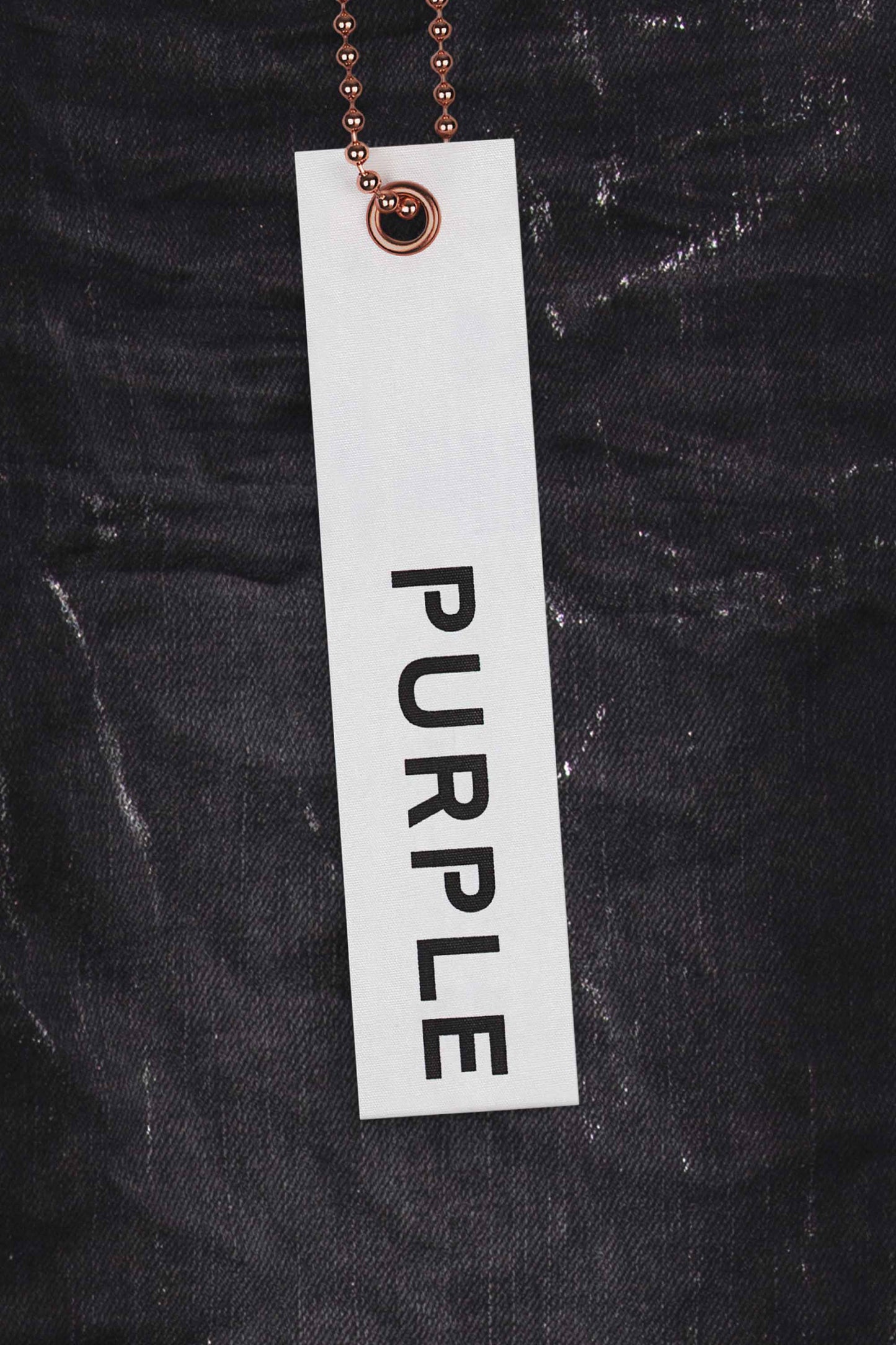 Low-rise skinny jeans in Black Wash with Metallic Silver finish, available in multiple sizes.