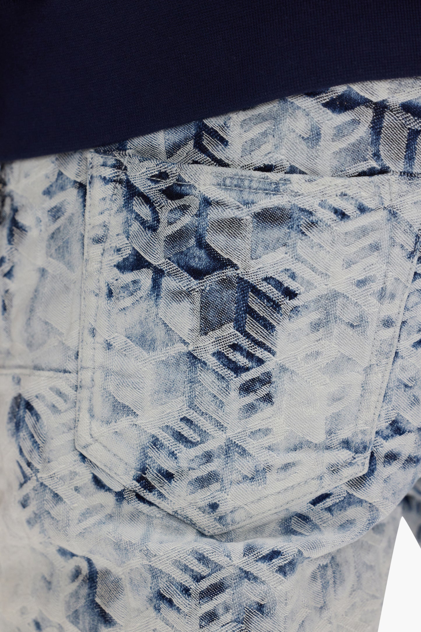 Jacquard Monogram Denim in low rise, stretch skinny fit with unique towel bleach pattern.