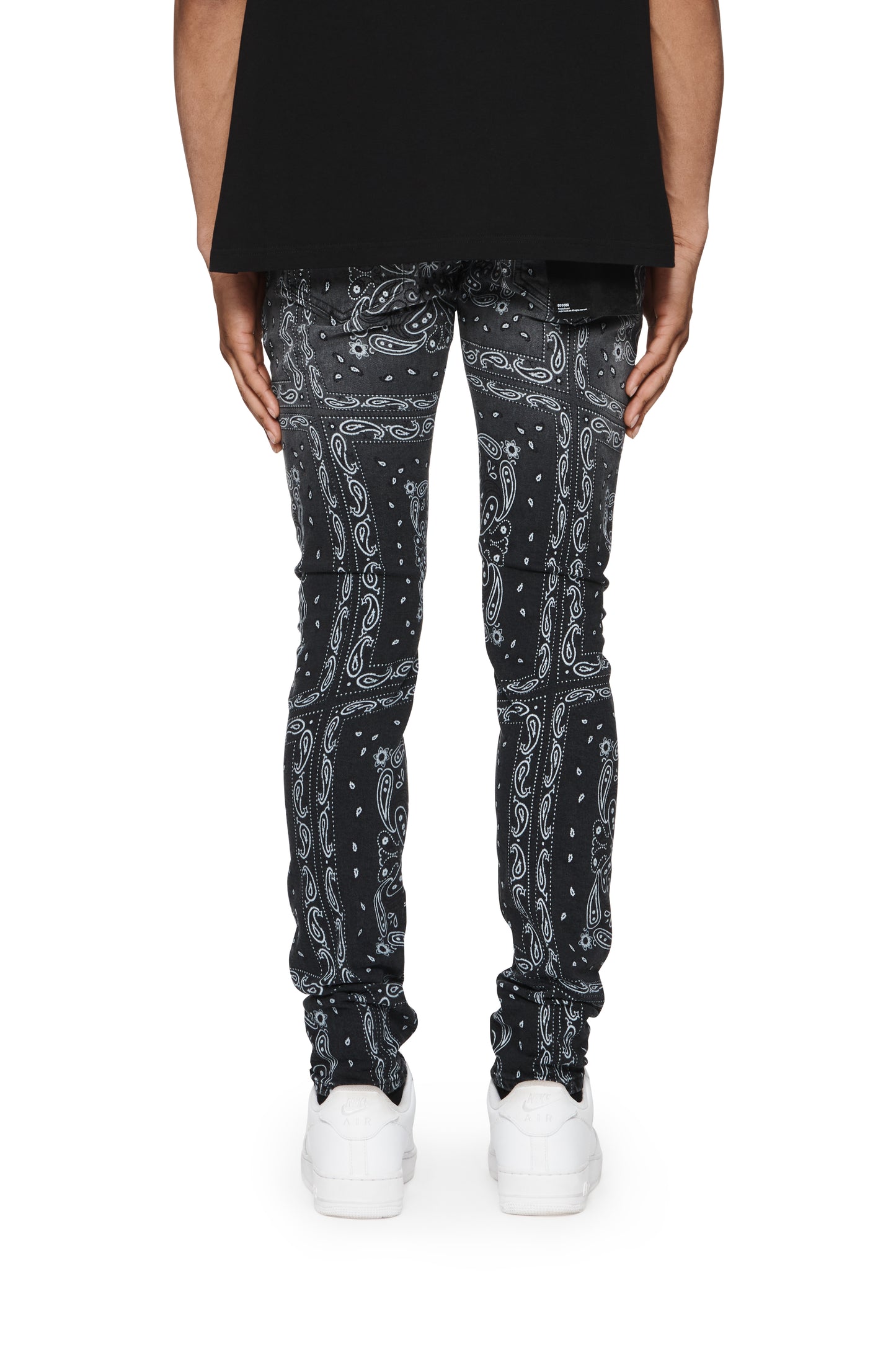Vintage Warped Bandana low rise skinny jeans in black stretch denim with signature leather patch.