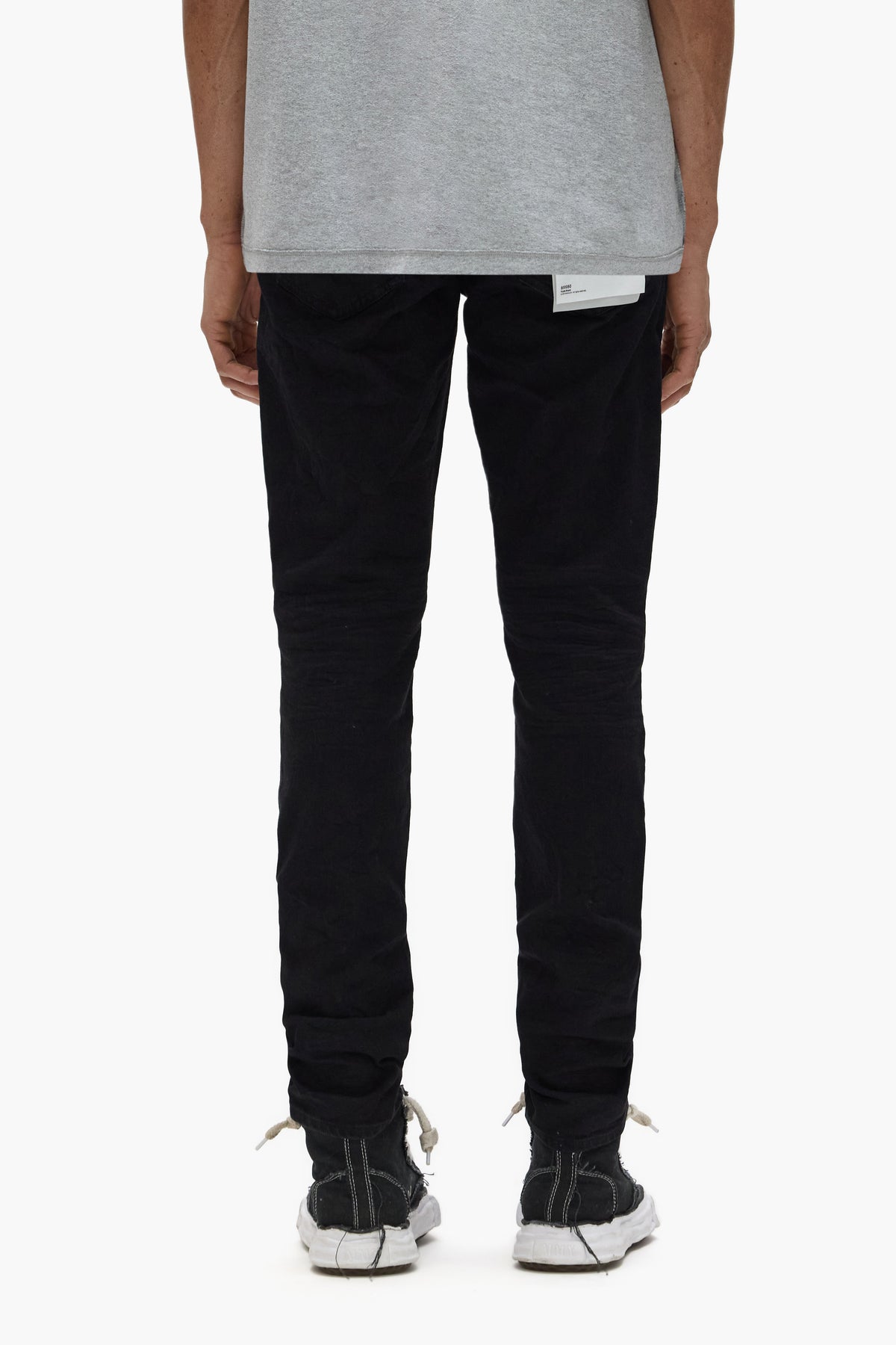 P002 Rinse Knee Slit denim jeans with drop waist and mid-rise fit in premium stretch fabric.