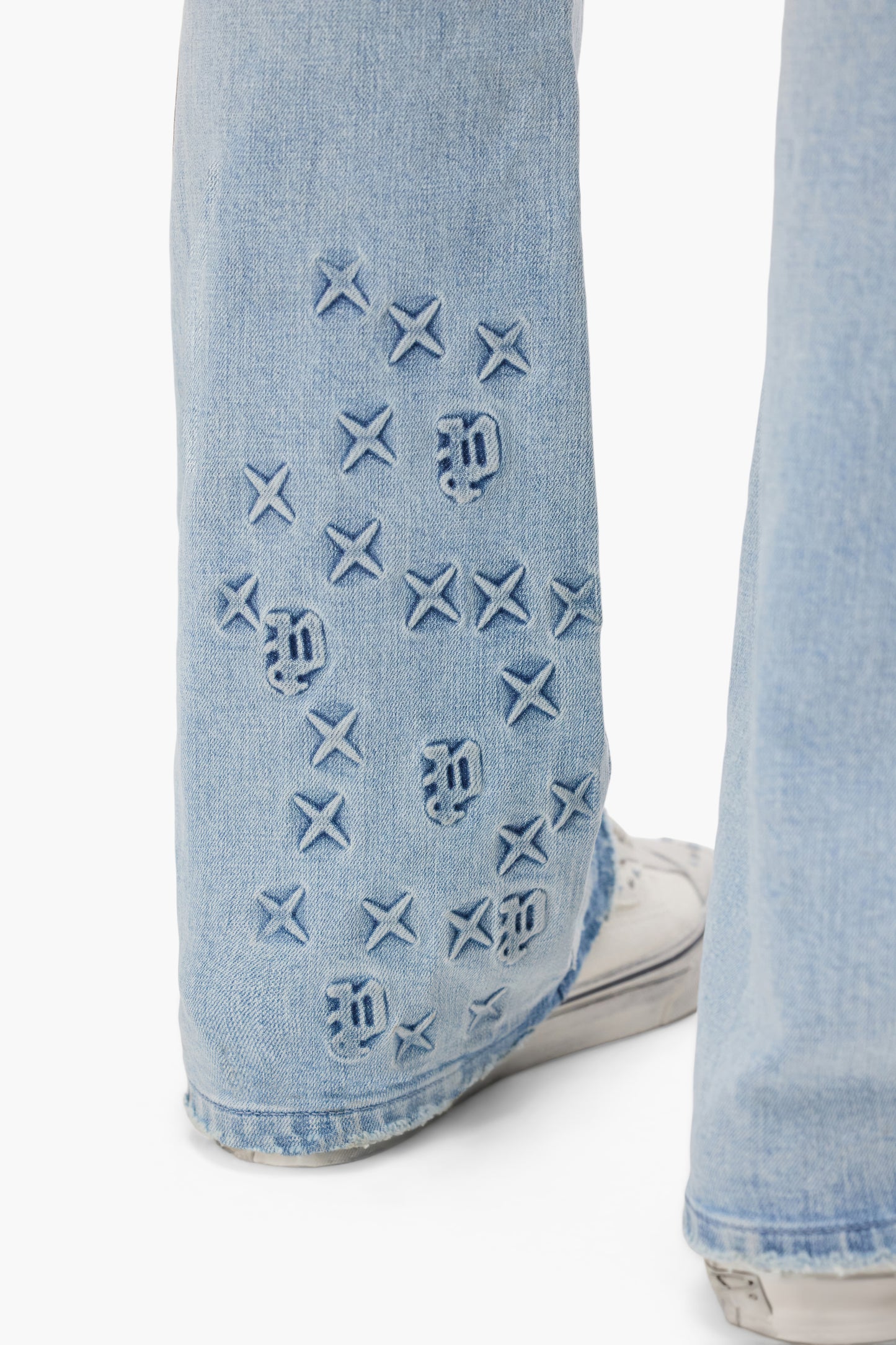 P004 Monogram Embossed Premium Stretch Denim in sizes 28 to 40 with a low rise design.