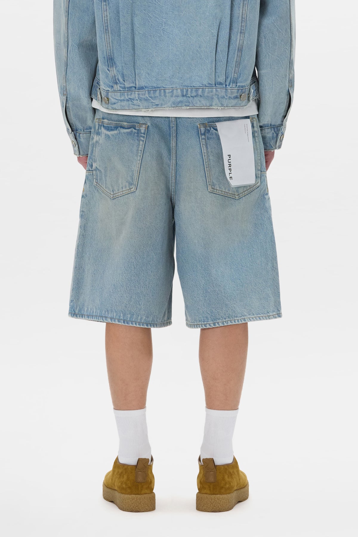 Pleated Short in baggy fit with button fly and pockets, available in sizes 28-40.