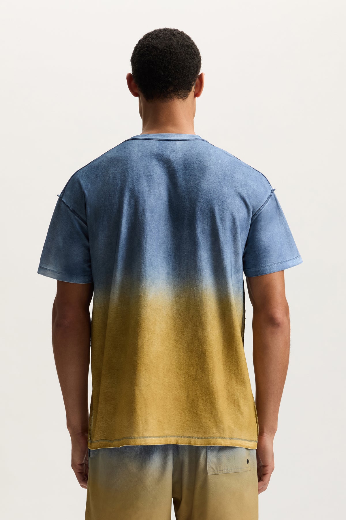 Wordmark Fade Tee in faded wash, regular fit, made of 100% cotton, available in various sizes.