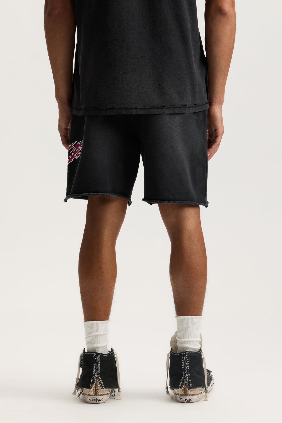 Slasher Short in heavy faded mid acid wash with elastic waistband and on-seam hand pockets.