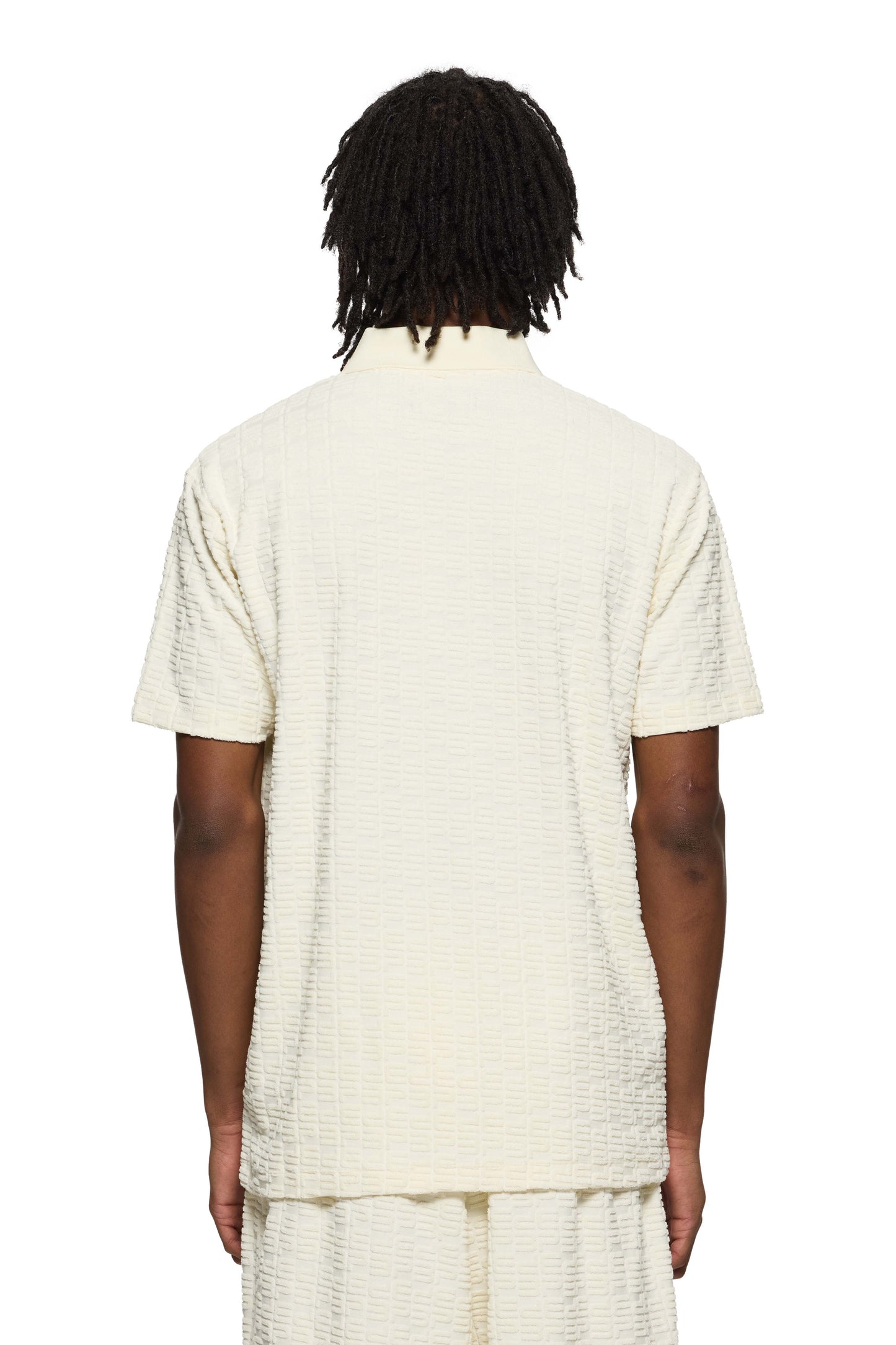 White towel-terry short-sleeve Terry Polo with Purple Brand logo and three-button opening.