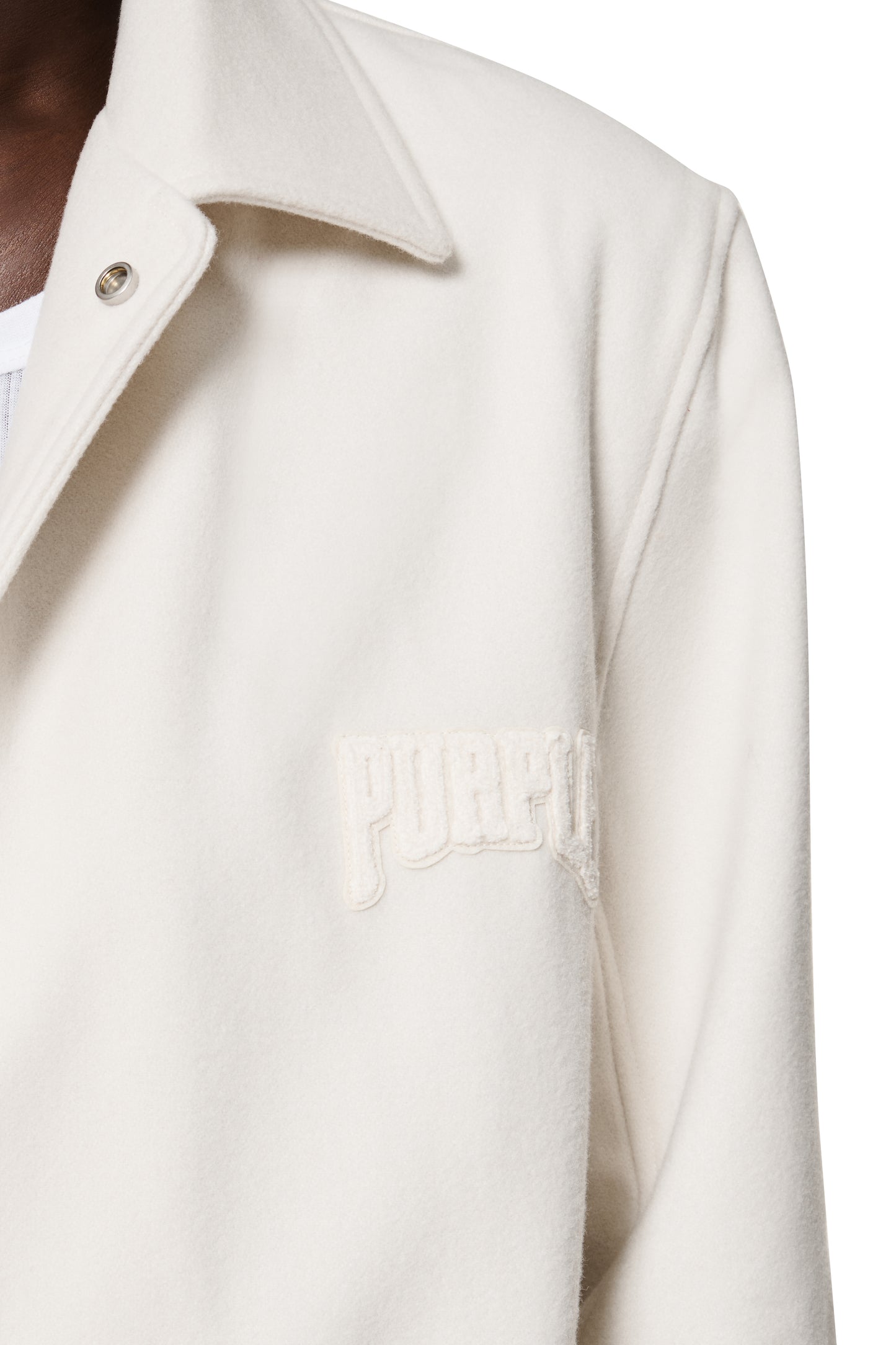 Off-white Letterman Jacket with zip-front, foldover collar, and chenille patch details.