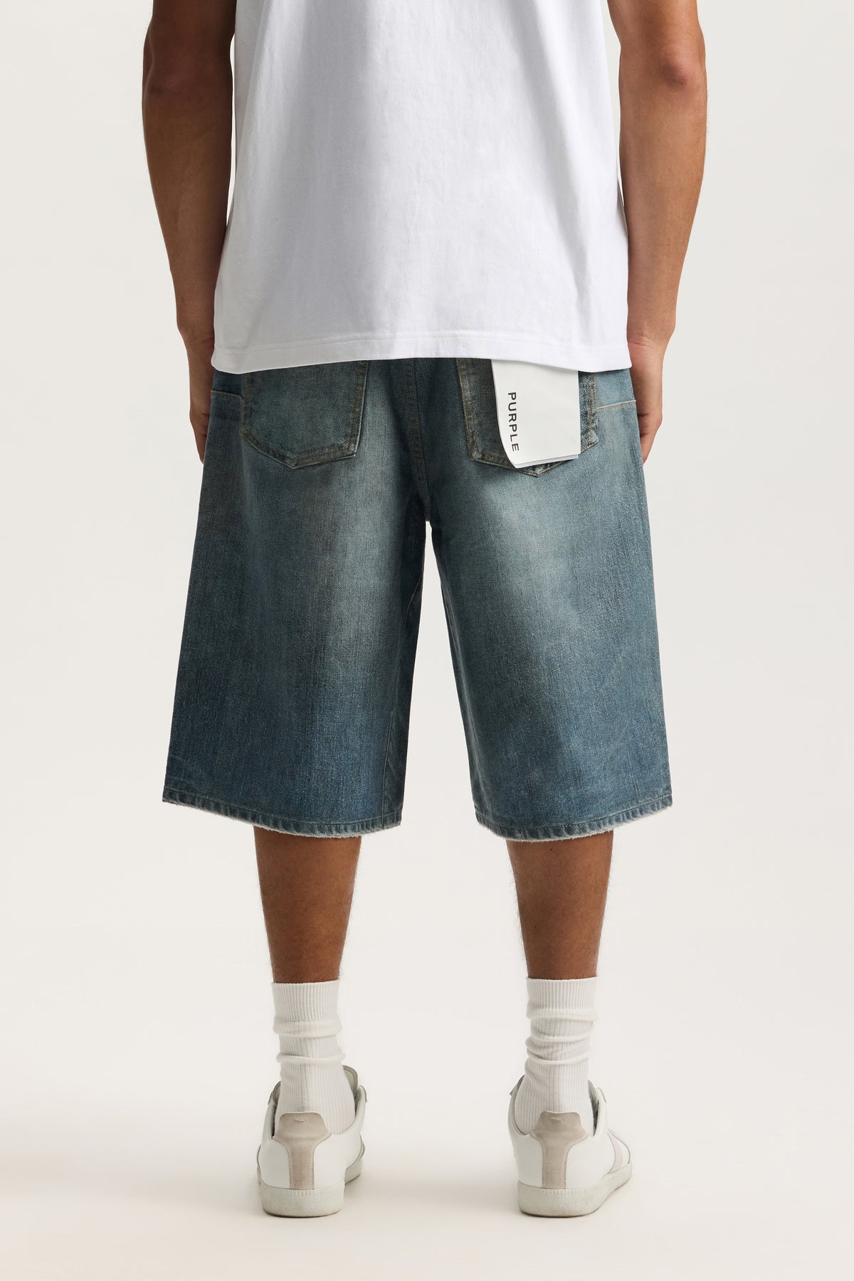 Jewel Long Shorts with digital denim print, wide leg, raw hem, and front pockets.