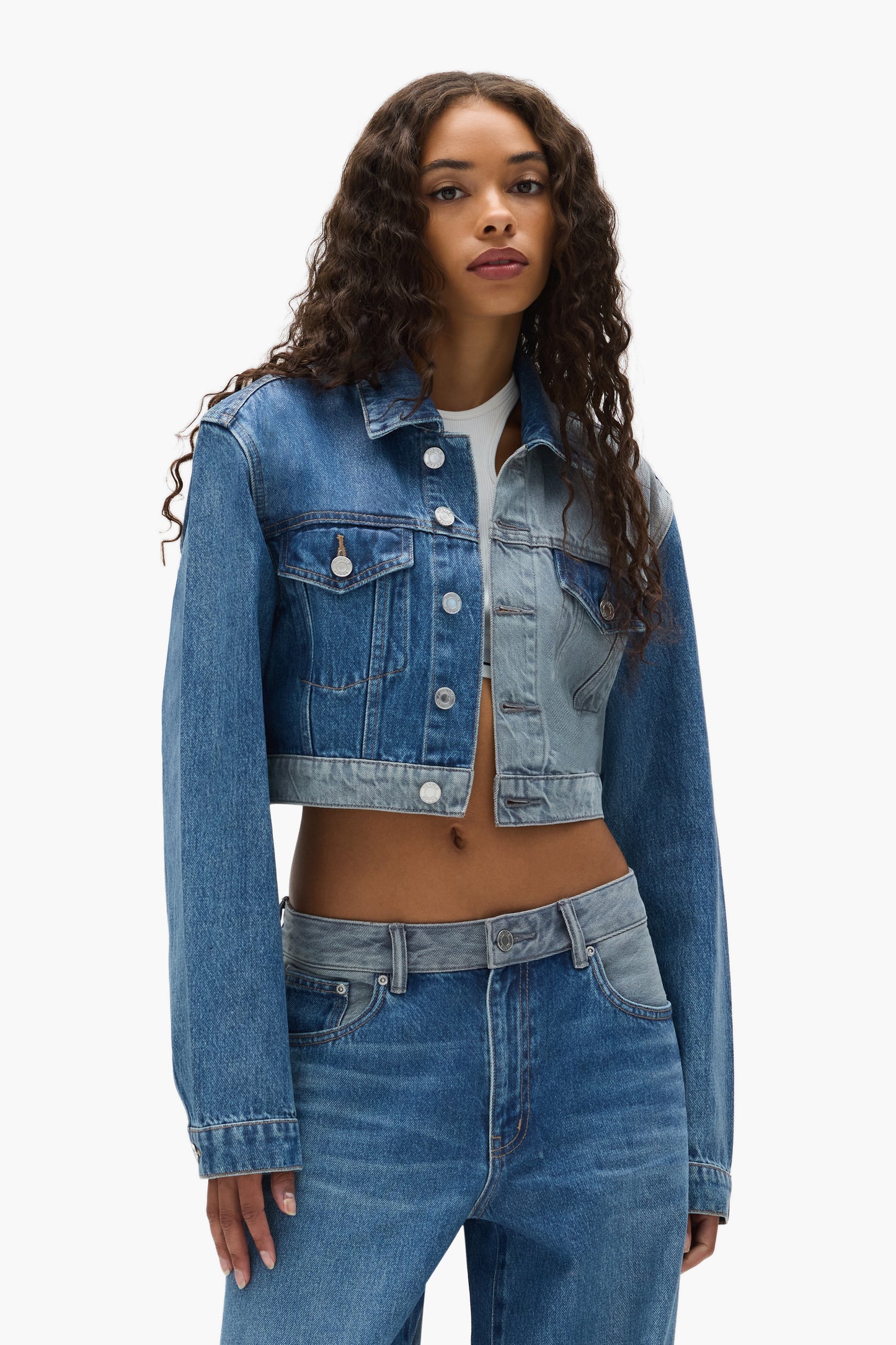 Dual Tone Cropped Jacket with front pockets, button closure, and adjustable back tabs