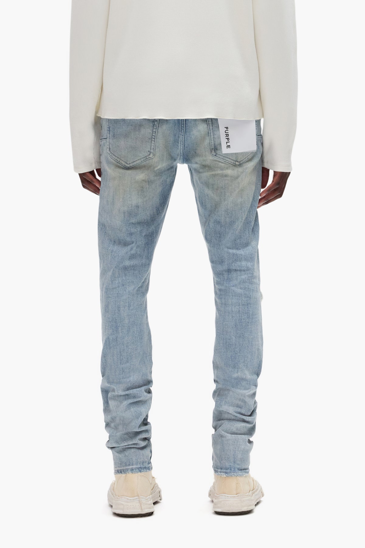 Three Year Light Indigo stretch skinny denim with abrasions and repairs, low rise, size options.