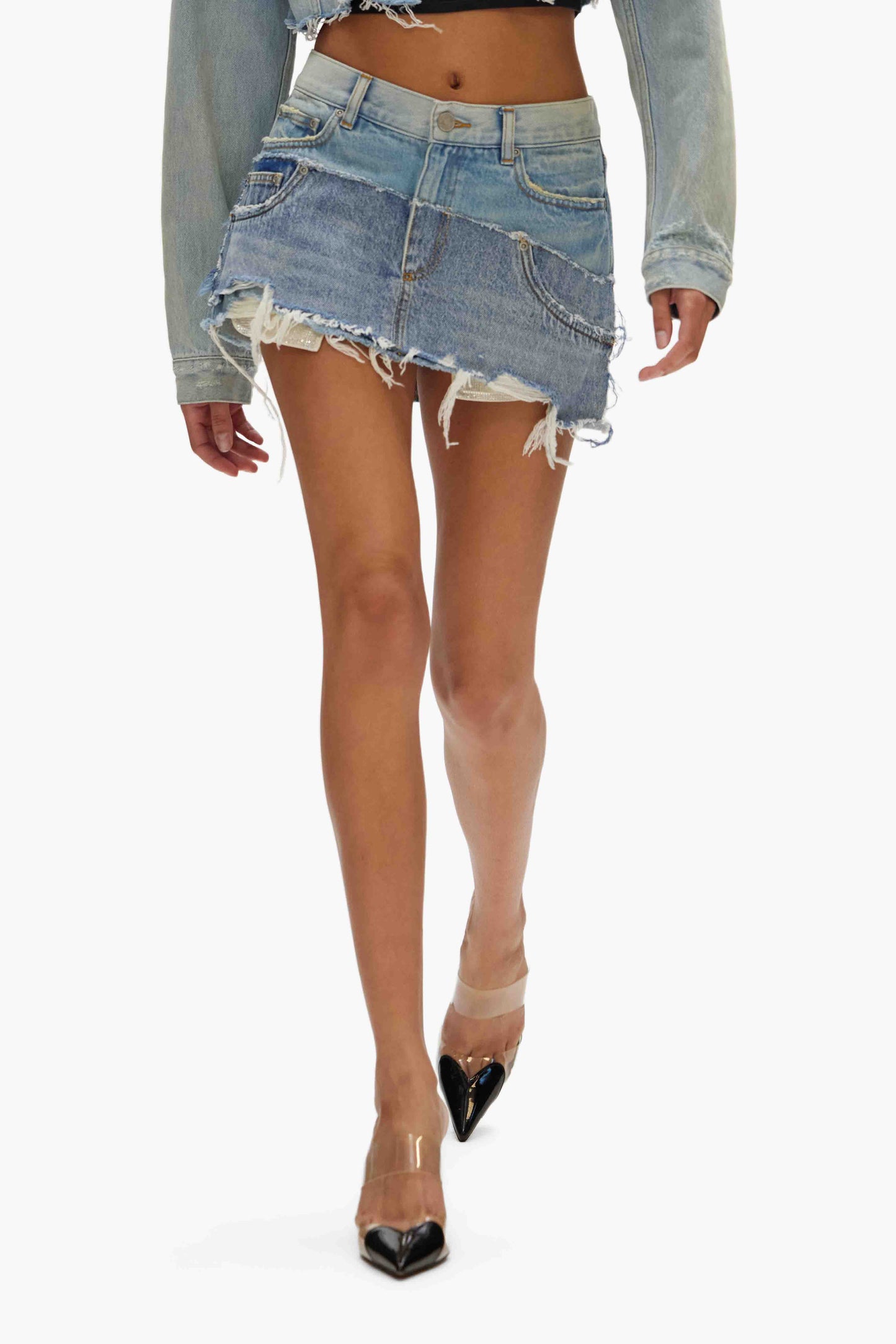 Double Denim Mini Skirt with indigo-washed denim and frayed hem, available in sizes XXS to XL.
