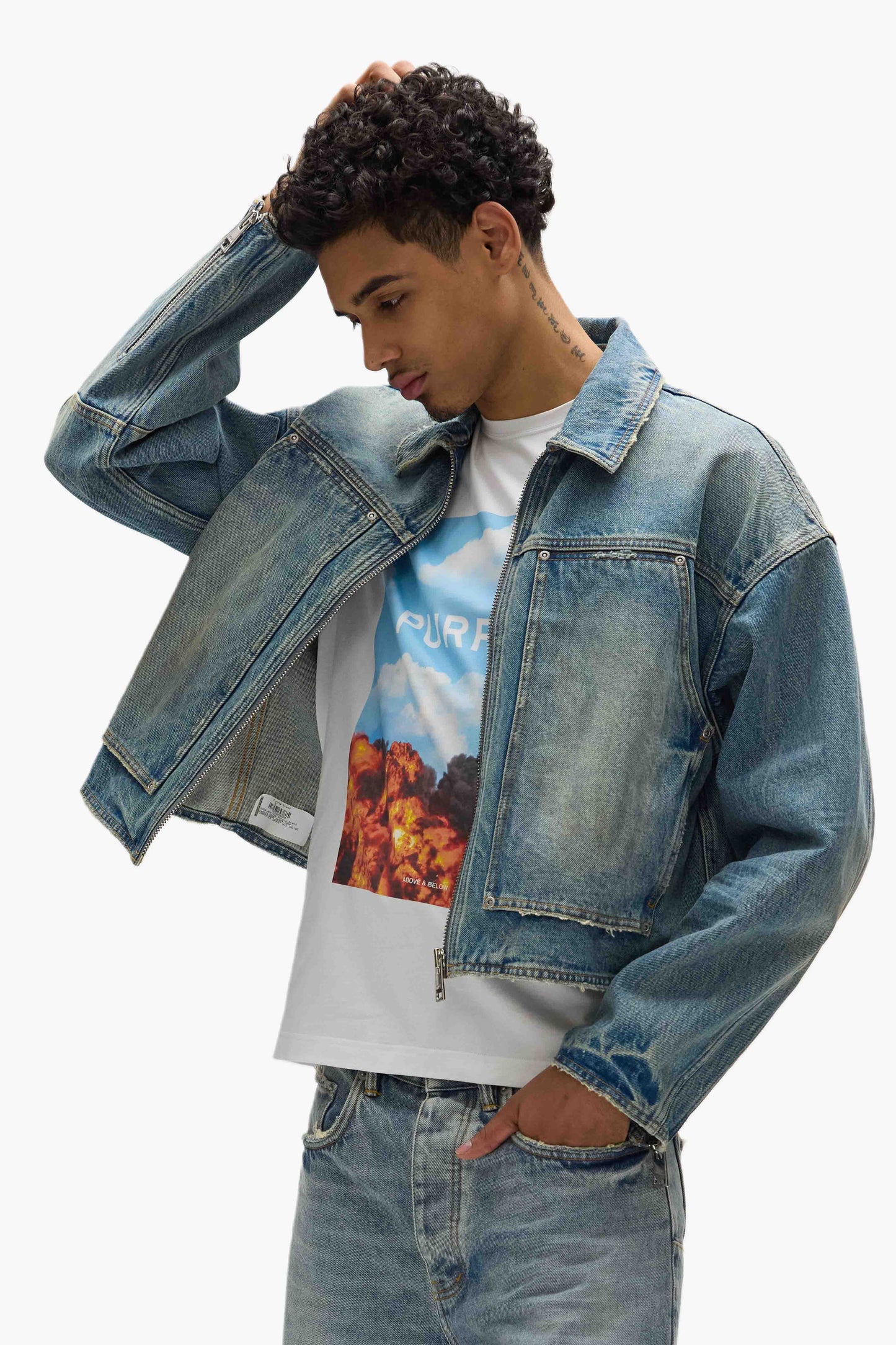 Cropped Carpenter Jacket in medium indigo wash with front and back yokes and chest pockets.