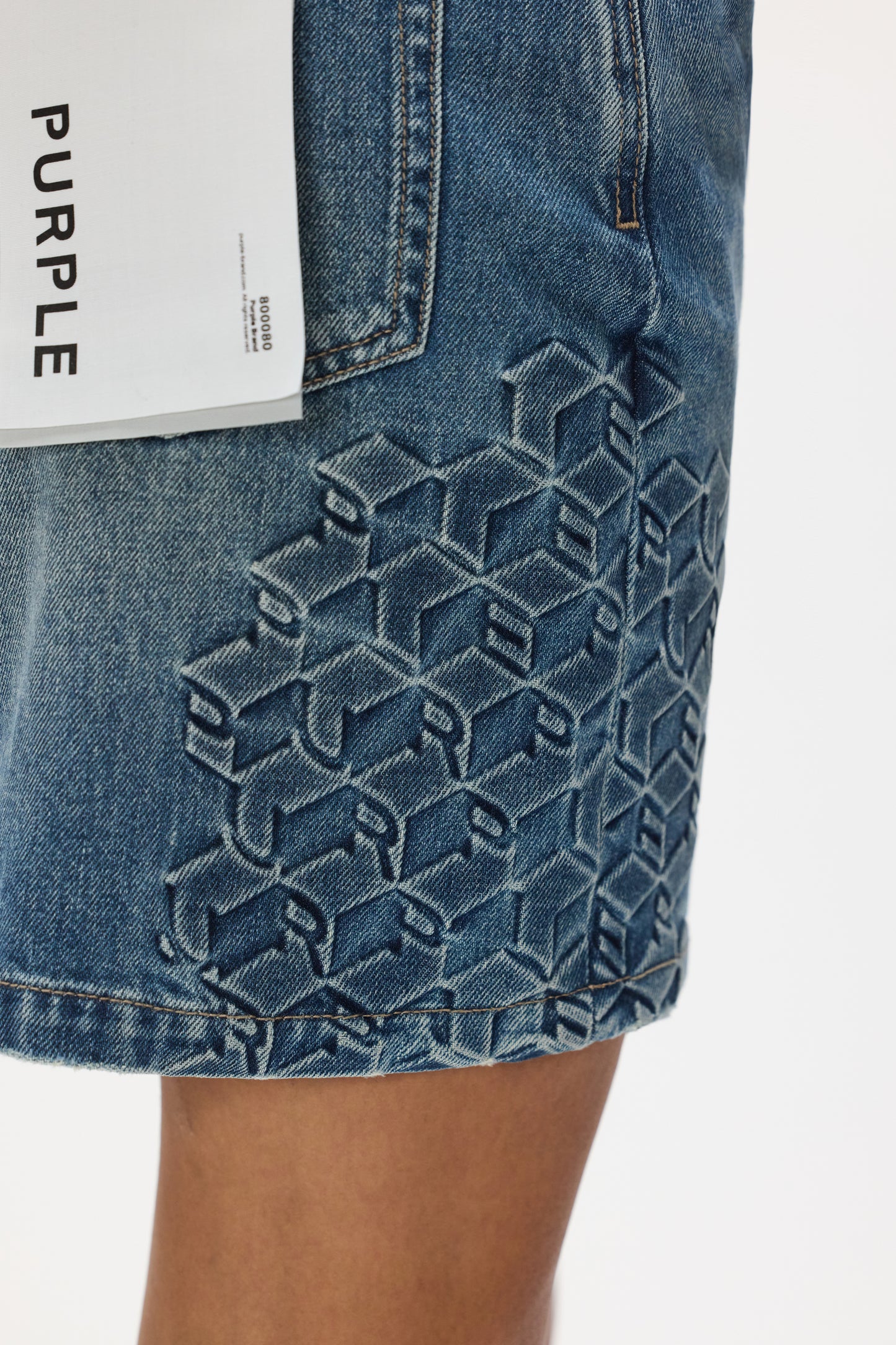 Embossed Monogram Mini Skirt, high rise, relaxed fit, 100% cotton, multiple sizes available.