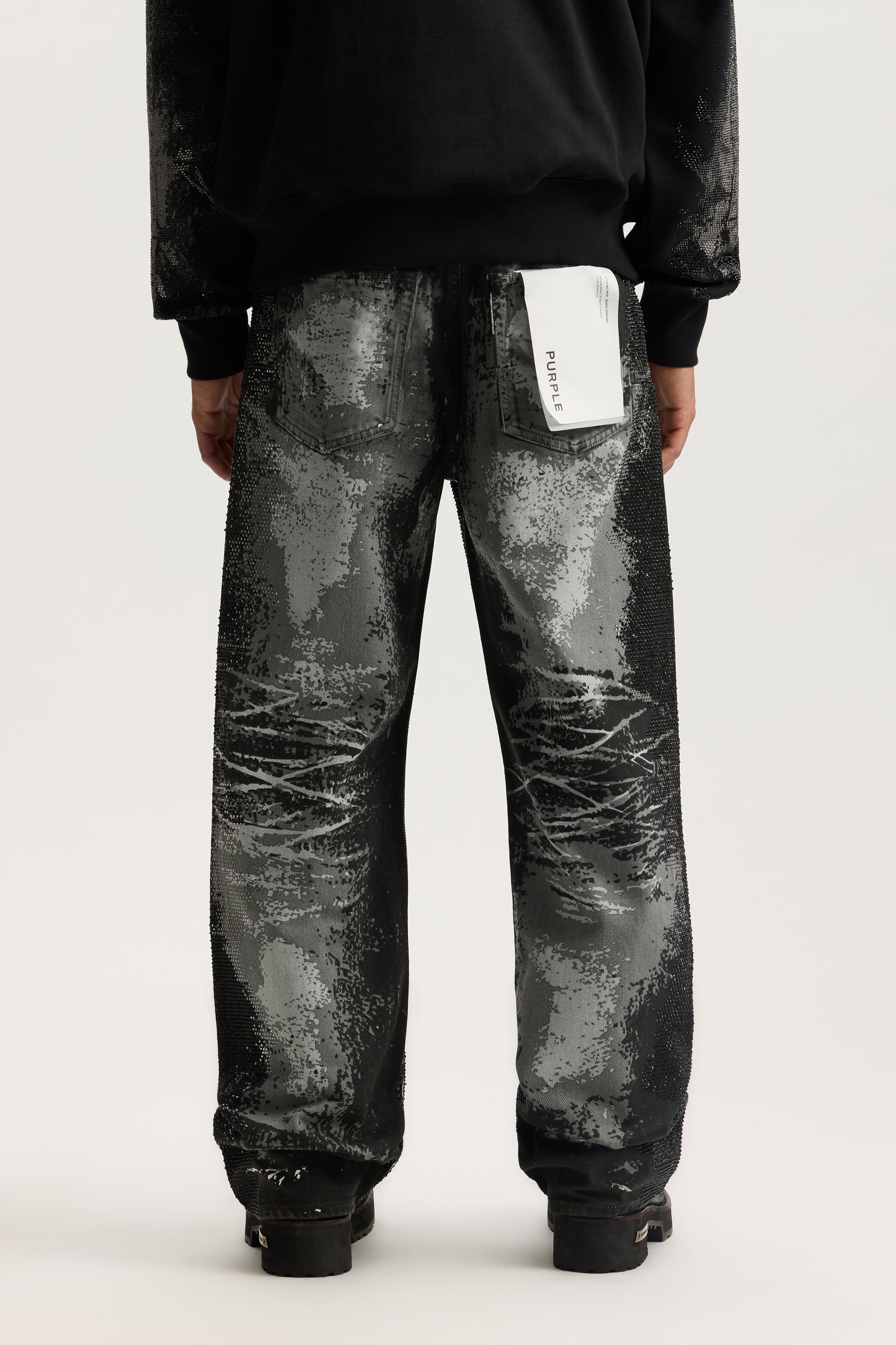 Trompe L'oeil baggy fit denim with screenprint and hotfix crystals, available in sizes 28-40.