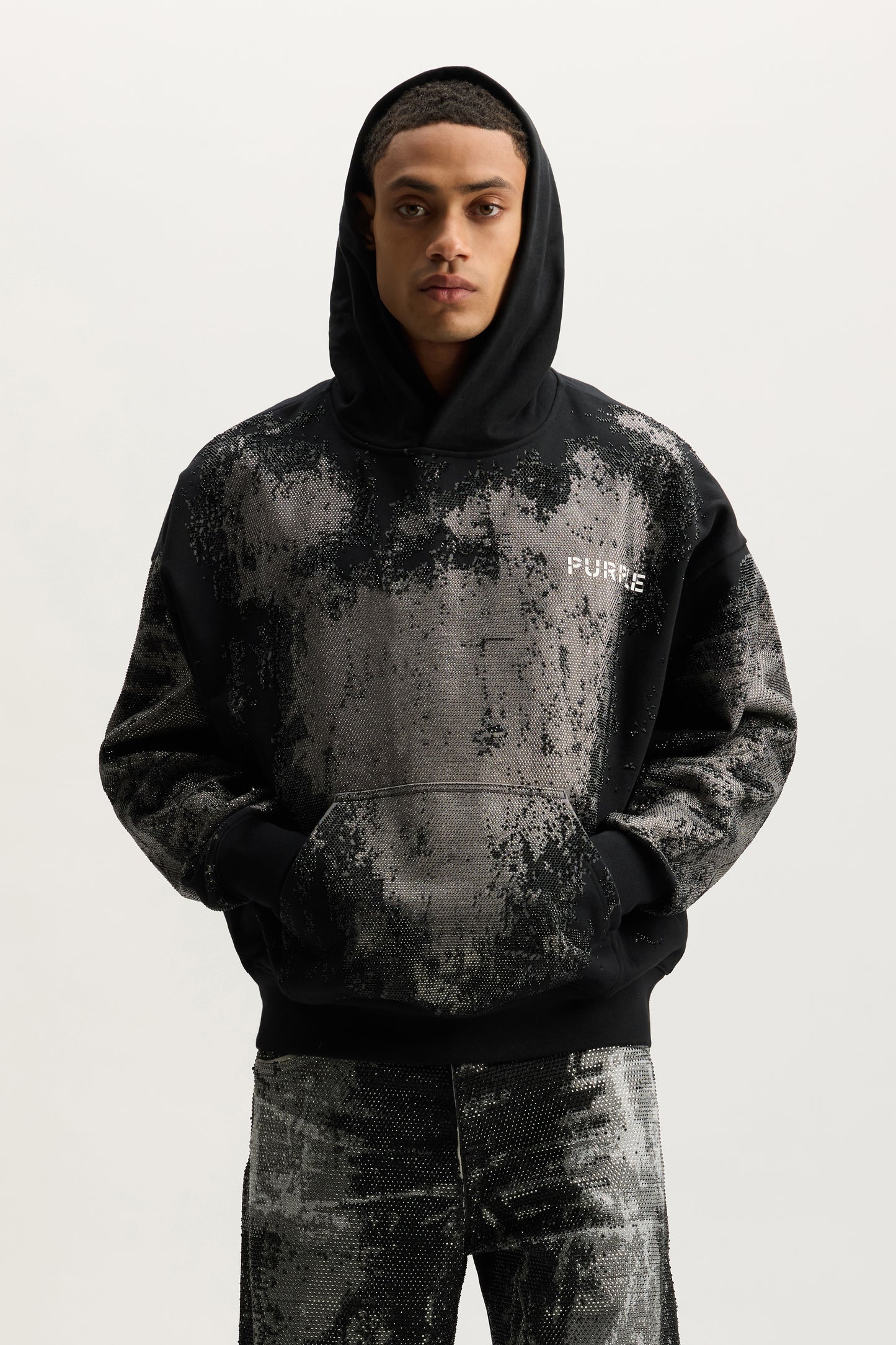 Worn Crystals Hoodie in oversized fit with kangaroo pocket and hotfix crystals detail.