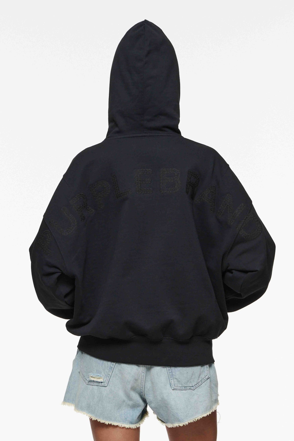 Wordmark Oversized Hoodie with lace pattern embroidery and hood drawcord in various sizes.