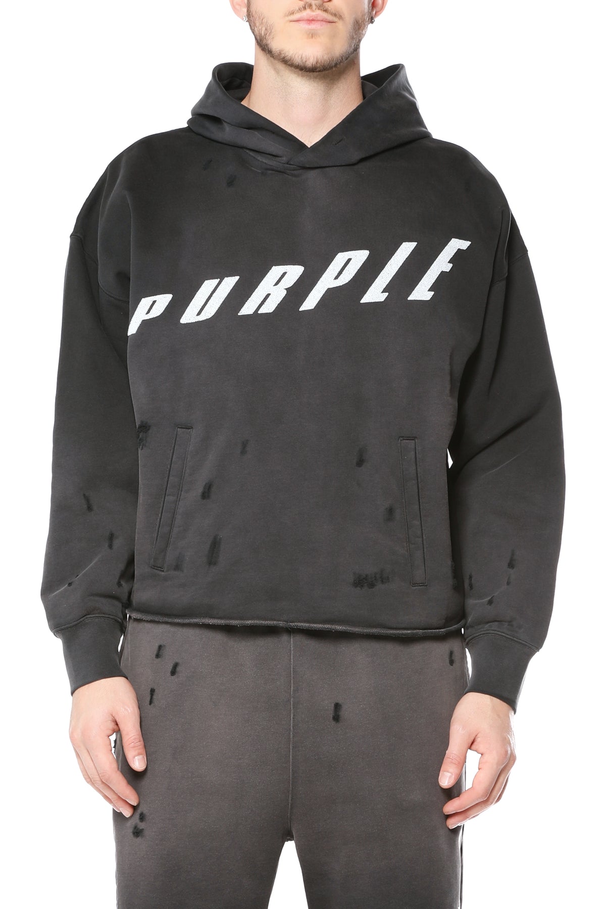 Oversized white sweatshirt with acid wash distress and white crystals fine rocks detail.