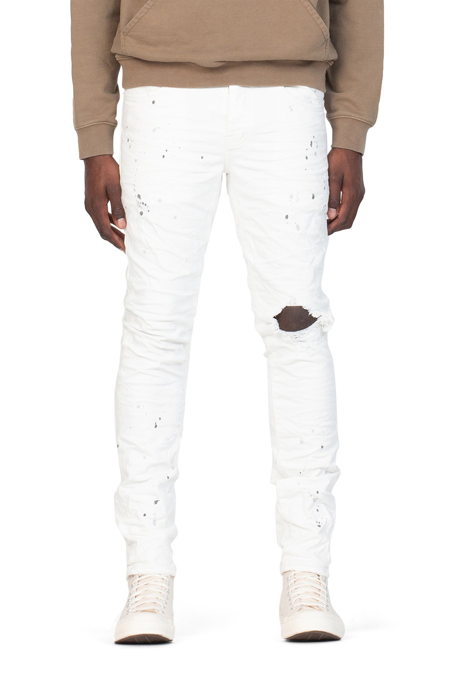 Worn Paint Blowout denim, low rise stretch skinny with knee blowout and gray paint detailing.