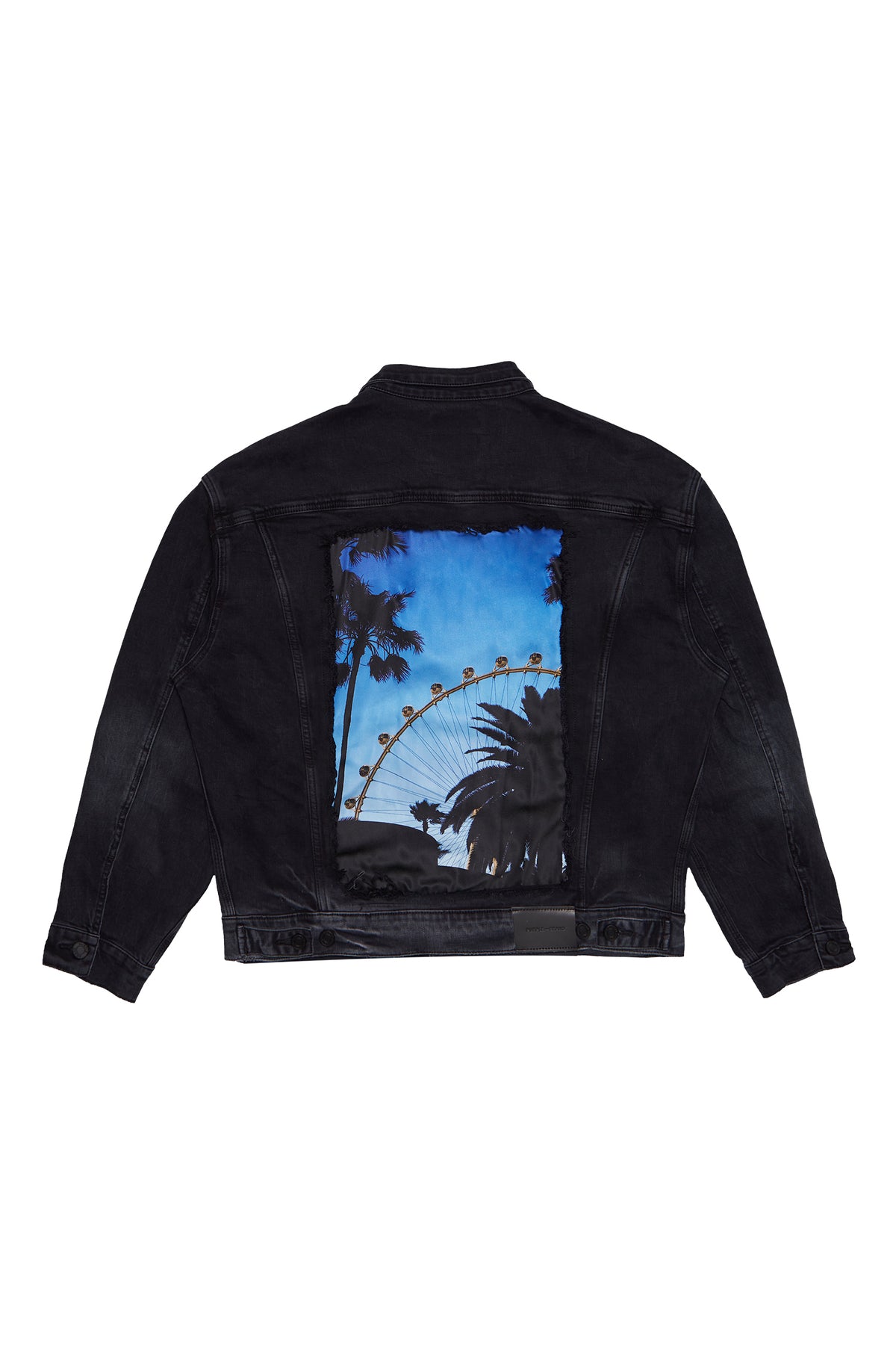 Oversized black denim trucker jacket with back graphic and double flap chest pockets.