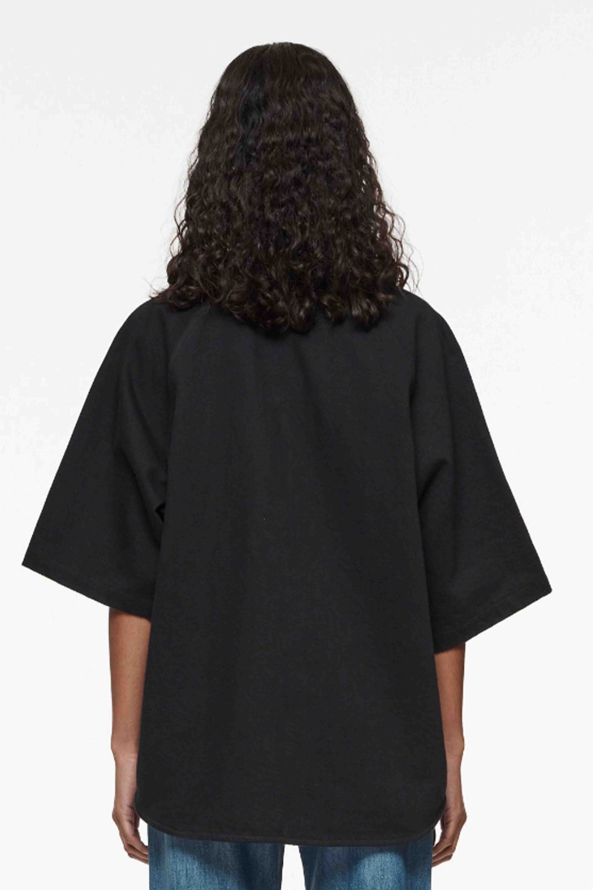 Baseball Shirt with oversized fit and applique logo on front, available in various sizes.