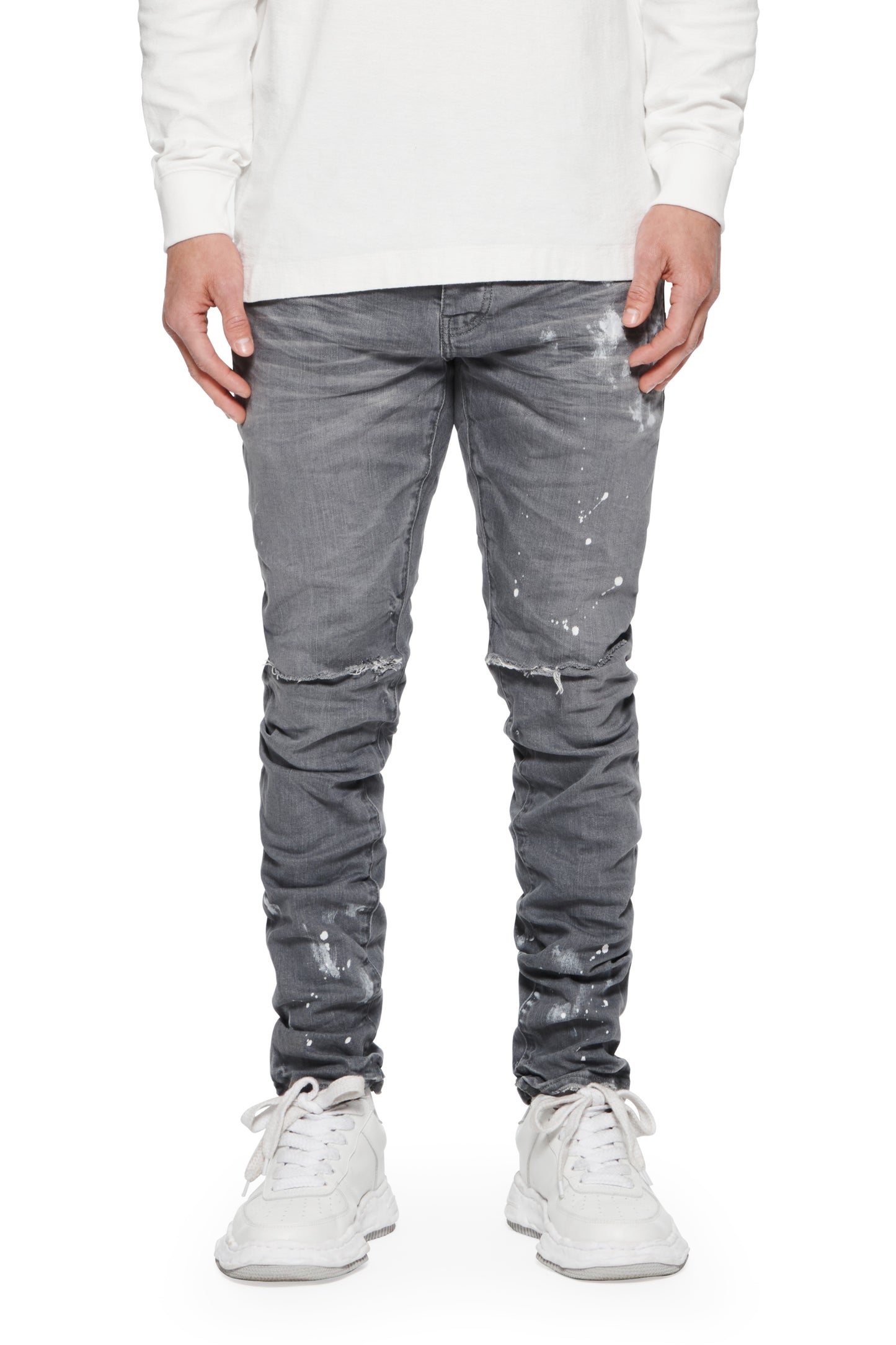 Dapple Vintage Rip denim, low rise stretch skinny with distress and dual knee slits.