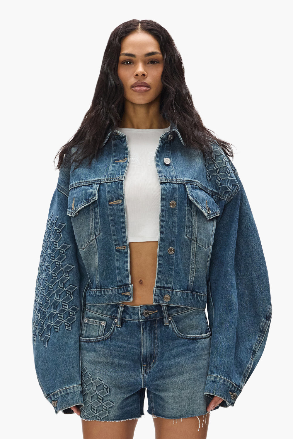 Monogram Jacket cropped outerwear with front chest pockets and embossed monogram details.