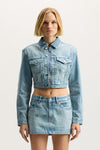 Monogram Jacket in light indigo with cropped length and front zipper closure.