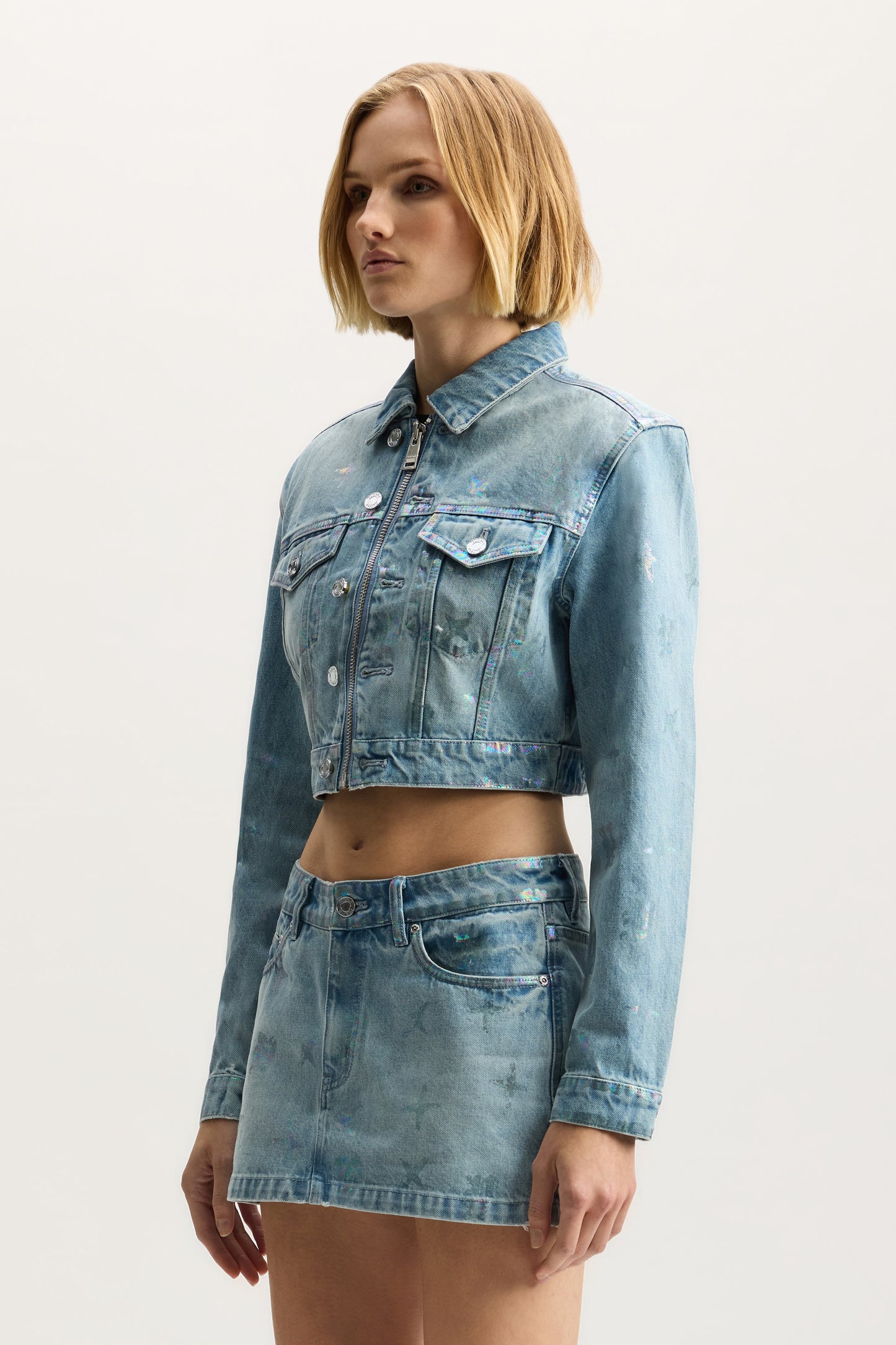 Monogram Jacket in light indigo with front zipper closure and chest pockets.