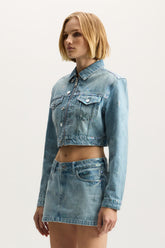 Monogram Jacket in light indigo with front zipper closure and chest pockets.
