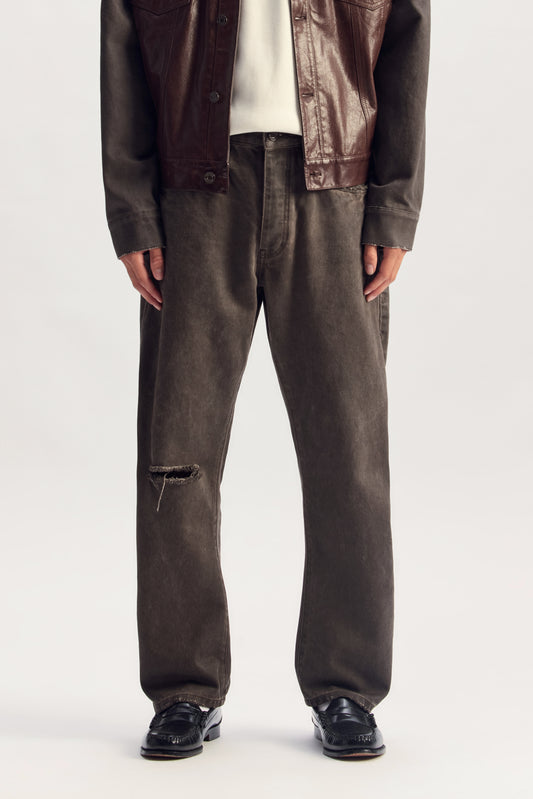 P013 Overdye Destroy denim jeans with knee slits, tapered barrel leg, available in various sizes.