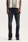 Black coated denim low rise slim fit flared jeans with branded leather patch and 5 pocket styling.