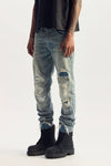 Vintage Destroy Denim in light indigo, mid-rise, slim straight with rip & repair details.