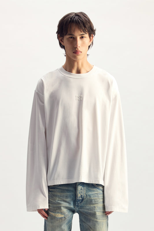 Stacked Wordmark Long Sleeve Tee in white, oversized fit, 100% cotton, Pre Spring 2027 collection.