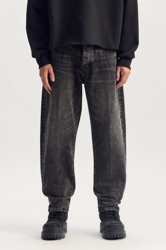 P013 Clean Tapered denim in various sizes with mid rise and tapered barrel leg shape.