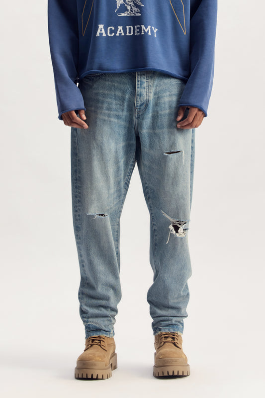 P013 Destroy Tapered denim, mid-rise, tapered fit with slight barrel leg shape, 100% cotton.