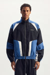 Wordmark Track Jacket in navy, relaxed fit with TPU logo and zipper hand pocket.