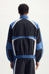 Wordmark Track Jacket in navy, relaxed fit with TPU Wordmark and zipper hand pocket.