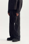 Embossed Tech Pant with zipper hand pockets and elasticated waistband, relaxed fit.