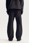 Embossed Tech Pant with zipper hand pockets and elasticated waistband in relaxed fit.