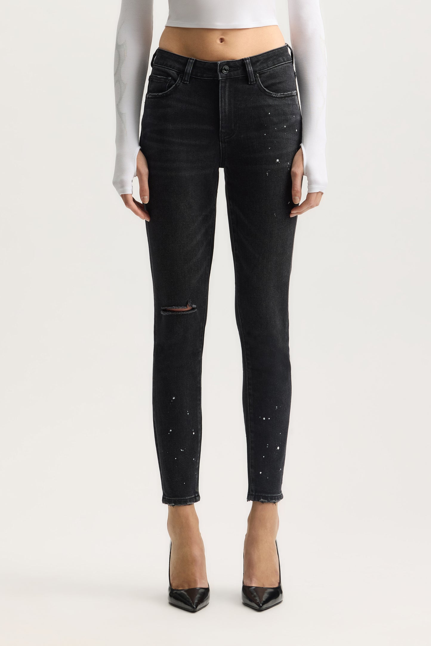 Mid Rise Skinny Denim Jeans with Paint Splatter and Ankle Length, available in sizes 24-34.