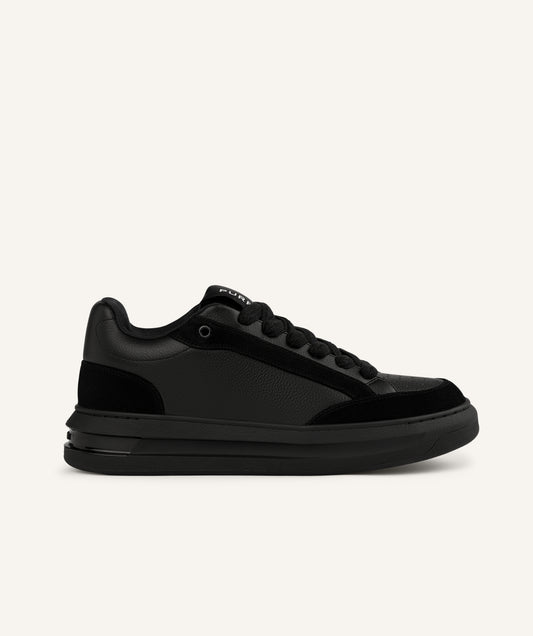 Black running shoe with pink sole on a white background