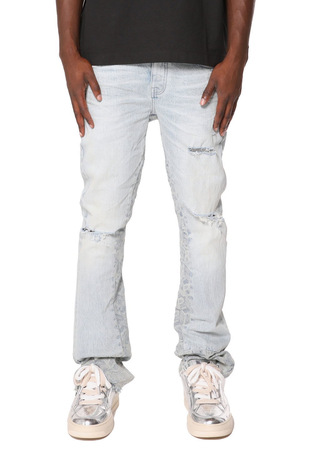 Slim fit flared leg jeans with jacquard monogram pattern, reinforced belt loops, front destroy.